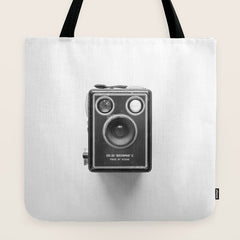 A Kodak Brownie analog vintage camera on a white background Retro photography in black and white Tote Bag