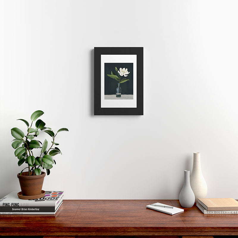 A flower in a vase Framed Art Print