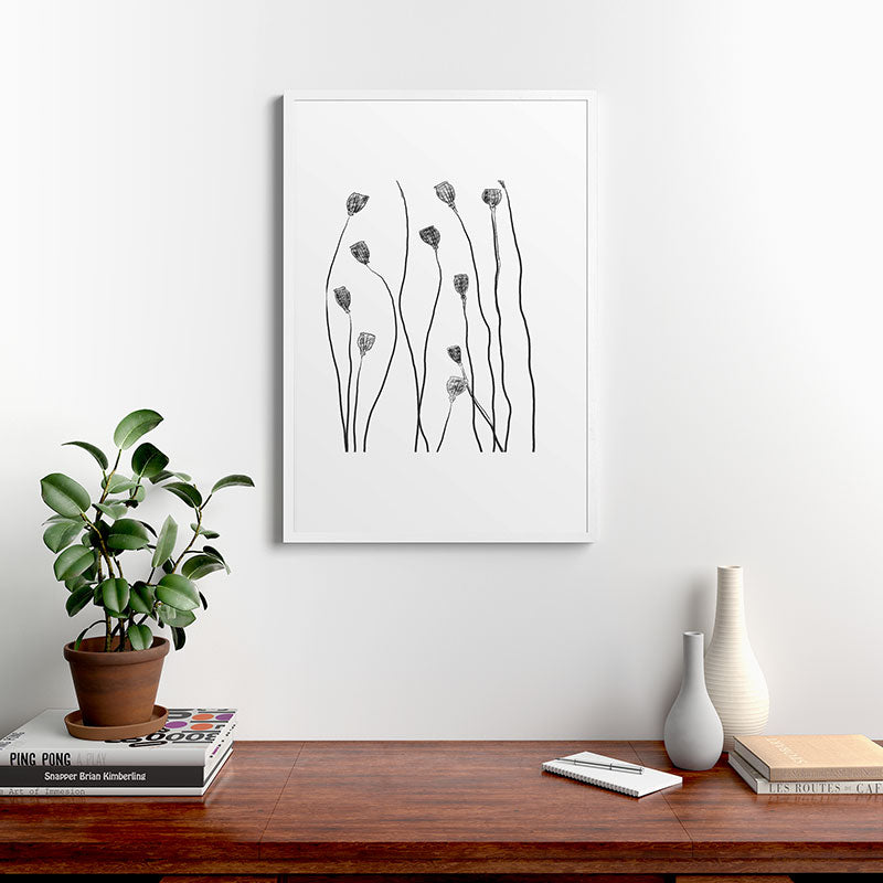 A group of poppy heads Framed Art Print